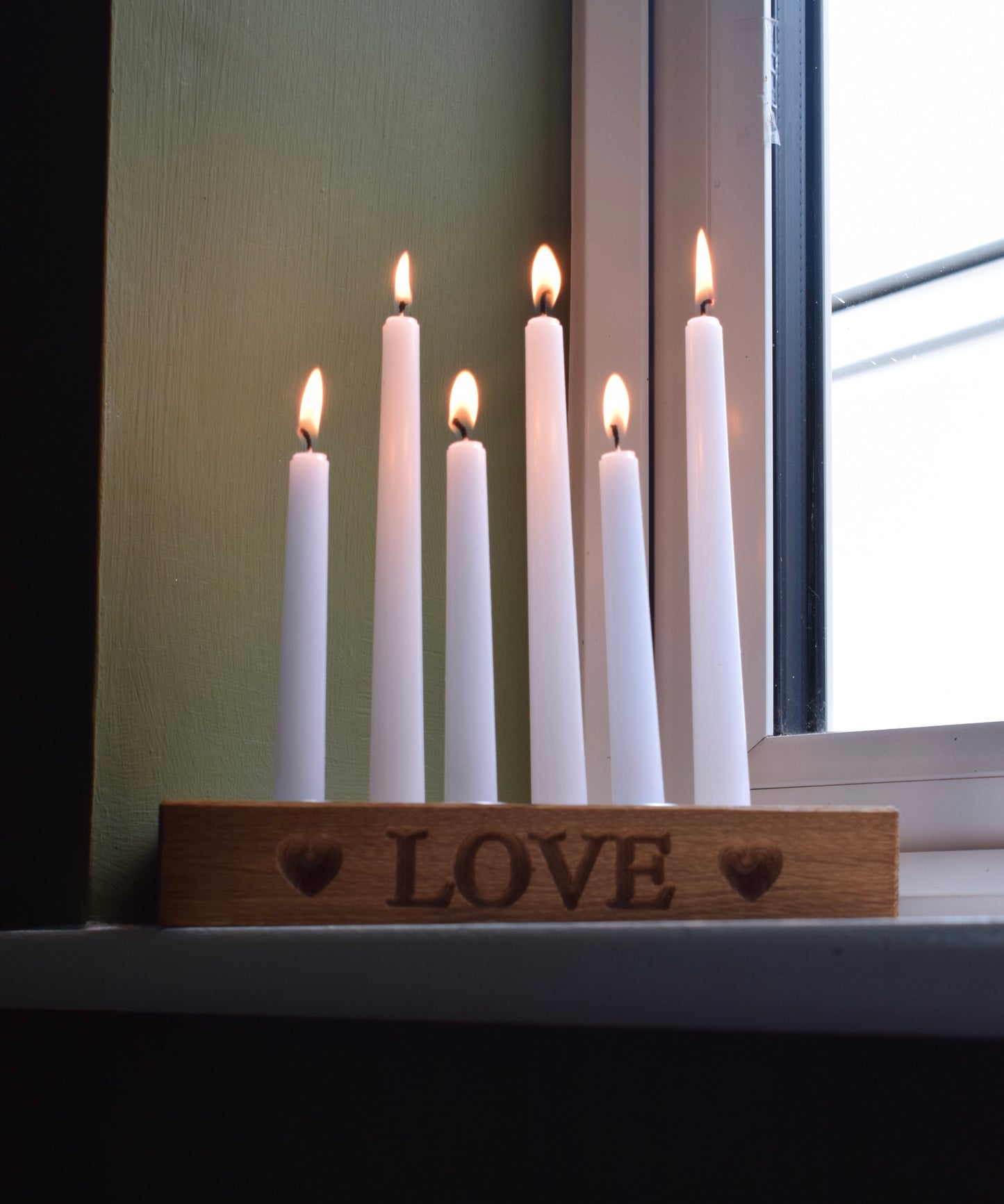 Personalised oak candle holder with 6 candles all light