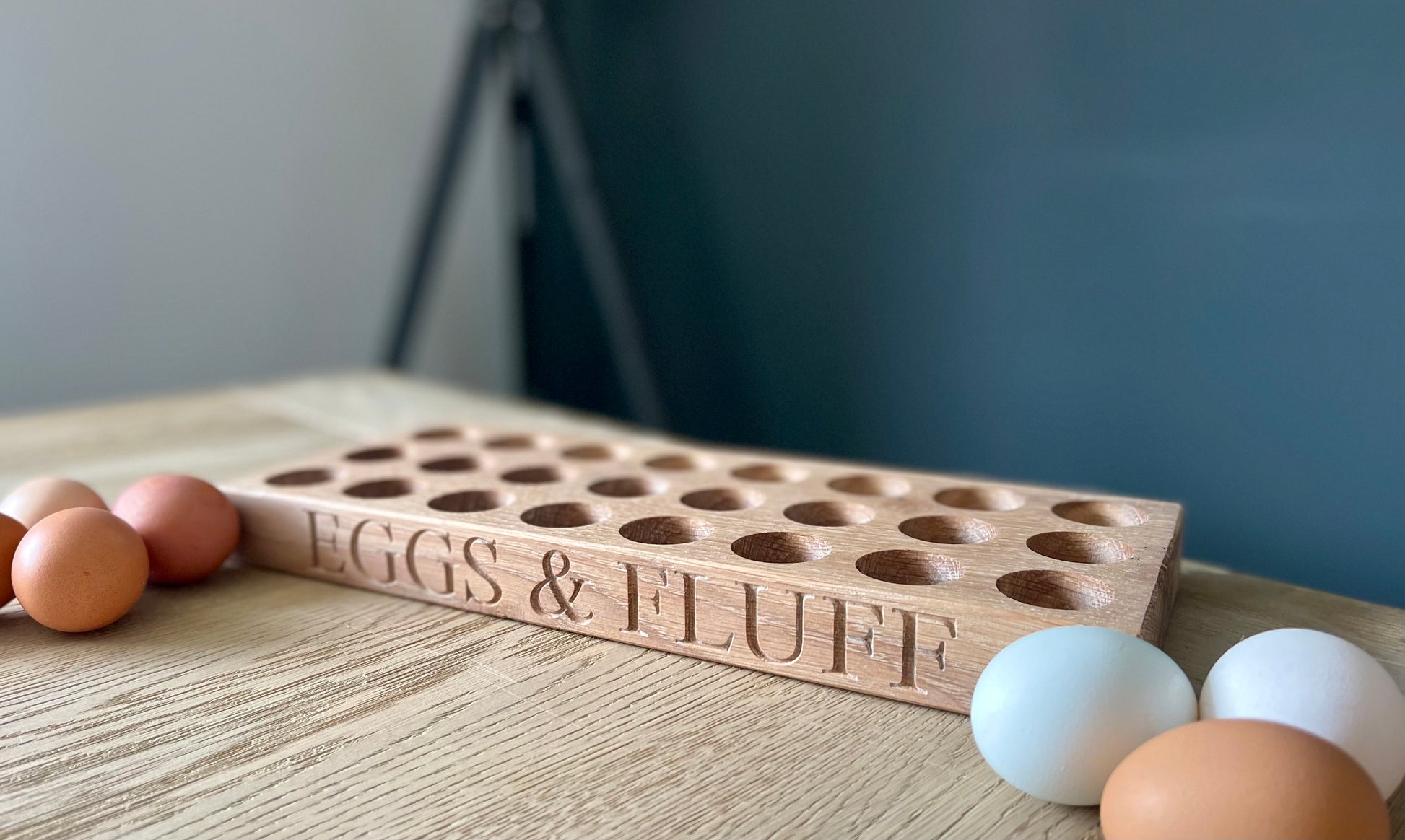 egg holder showing size of holes and eggs on the table