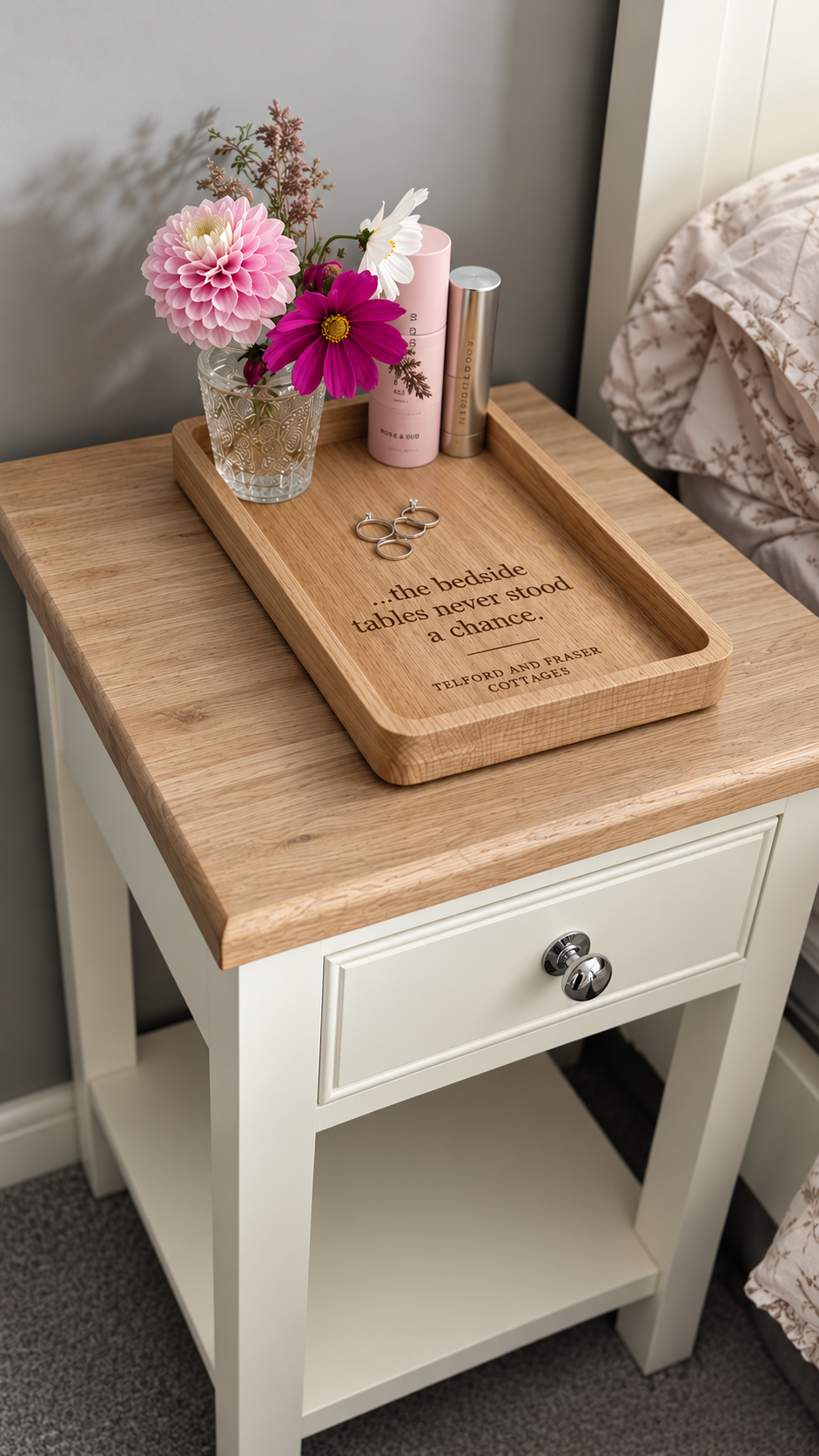 Handmade personalised oak bedside tray displayed on a bedroom bedside table