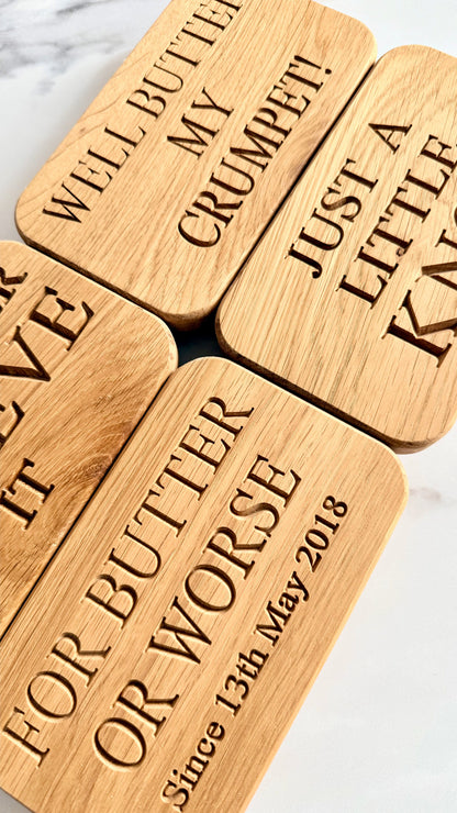 Wooden blocks with engraved text on a marble surface